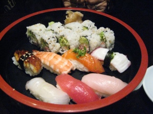 Sushi combo: cali roll, eel, shrimp, salmon, octopus, yellowtail, tuna, and mackrel 